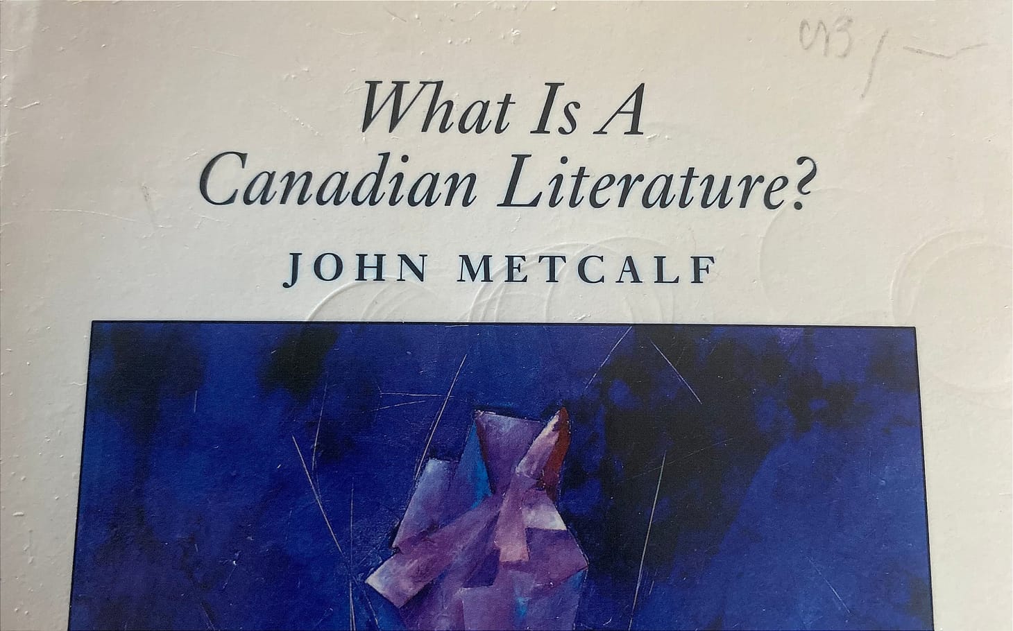 A worn cover of a second-hand copy of What Is A Canadian Literature? by John Metcalf